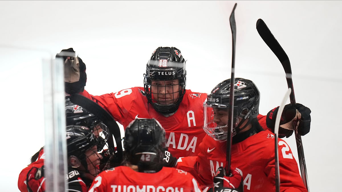 AP Photo/Petr David Josek : Claire Thompson of Canada, down, celebrates with teammates after scoring her sides first goal during the quarterfinal match between Canada and Japan at the Women's Ice Hockey Championships in Ceske Budejovice, Czech Republic.
