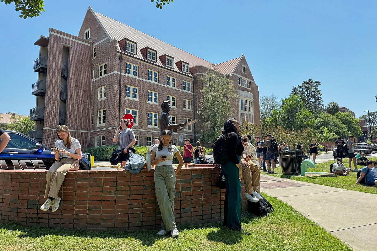 AP Photo/Kate Payne : Florida State University students wait for news amid an active shooter incident at the school’s campus in Tallahassee, Fla., Thursday, April 17, 2025 