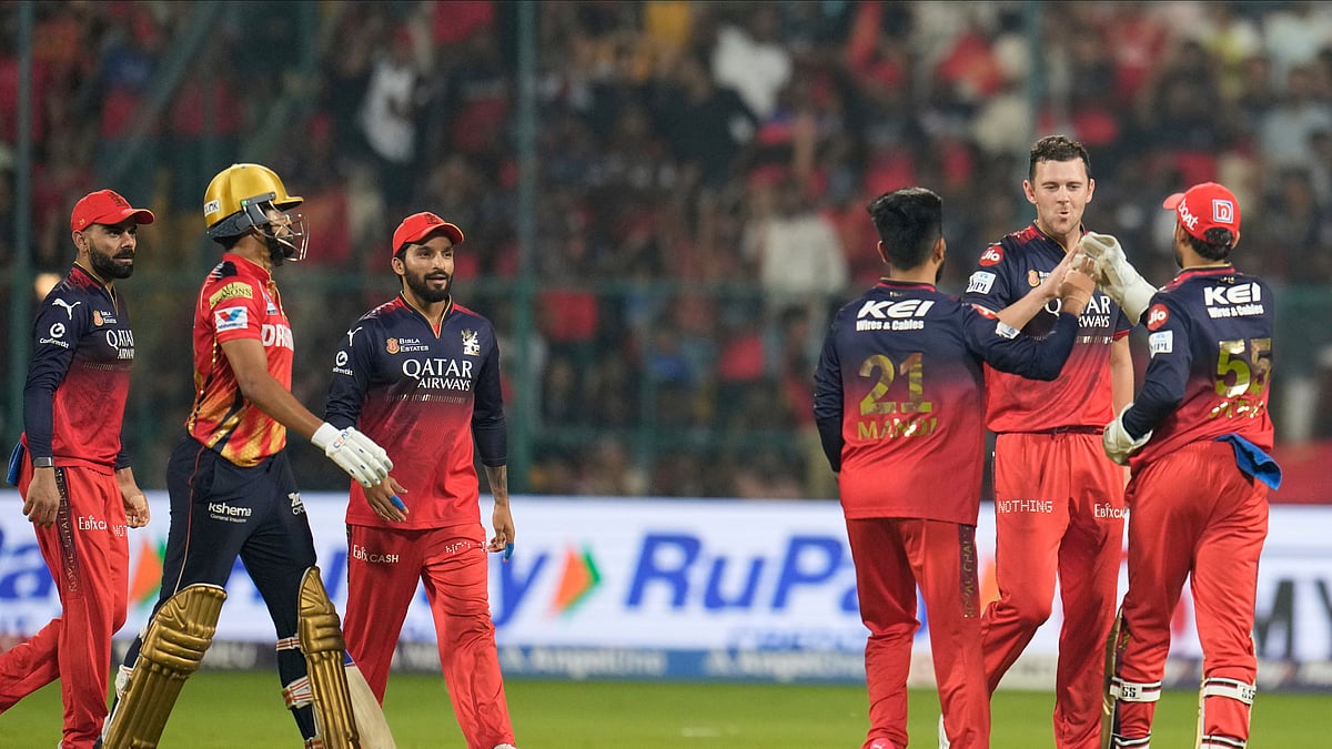 AP Photo/Aijaz Rahi : Royal Challengers Bengaluru's Josh Hazlewood, second right, celebrates with teammates after the dismissal of Punjab Kings' captain Shreyas Iyer, second left, during the Indian Premier League cricket match between Royal Challengers Bengaluru and Punjab Kings at Chinnaswamy Stadium in Bengaluru.