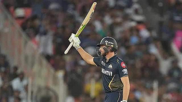 AP : Gujarat Titans' Jos Buttler celebrates after scoring fifty runs against Delhi Capitals.