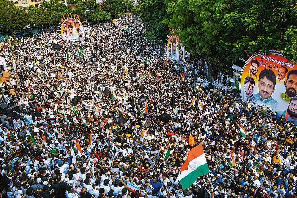 Many Questions: A crowd gathers near B.R. Ambedkar’s statue in Hyderabad, Telangana, to protest against the Waqf (Amendment) Act  - Photo: PTI