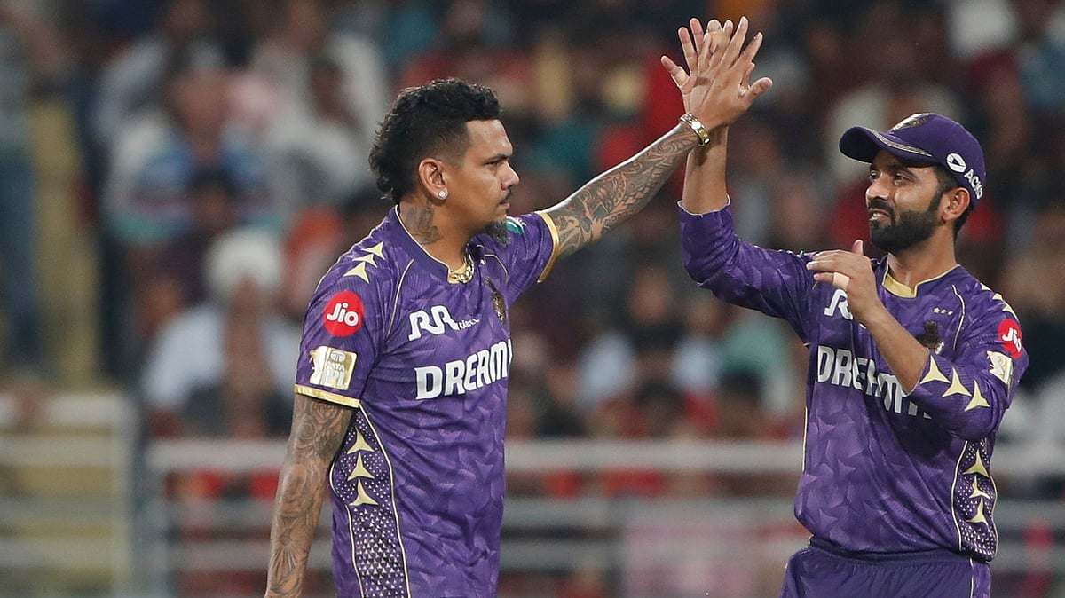 AP Photo/Surjeet Yadav : Kolkata Knight Riders' Sunil Narine, left, celebrates with captain Ajinkya Rahane after the dismissal of Punjab Kings' Marco Jansen during the Indian Premier League cricket match between Punjab Kings and Kolkata Knight Riders at Maharaja Yadavindra Singh Cricket Stadium in Mohali.