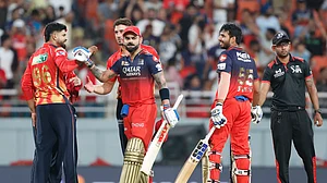 AP Photo/Surjeet Yadav : Royal Challengers Bengaluru's Virat Kohli, second right, and batting partner Jitesh Sharma leave the field after winning the Indian Premier League cricket match between Punjab Kings and Royal Challengers Bengaluru at Maharaja Yadavindra Singh Cricket Stadium in Mohali.