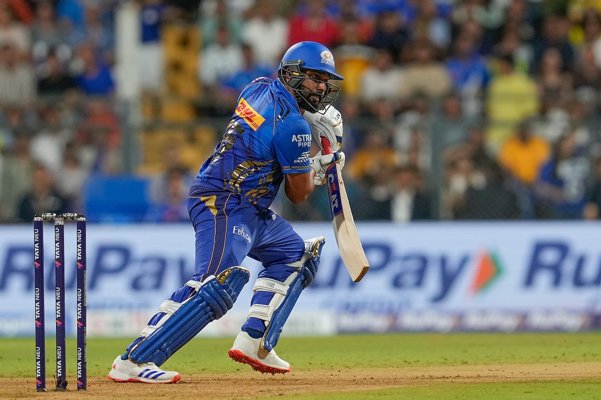  (AP Photo/Rajanish Kakade) : Mumbai Indians' Rohit Sharma plays a shot during the Indian Premier League cricket match between Mumbai Indians and Chennai Super Kings at Wankhede Stadium in Mumbai, India, Sunday, April 20, 2025.


