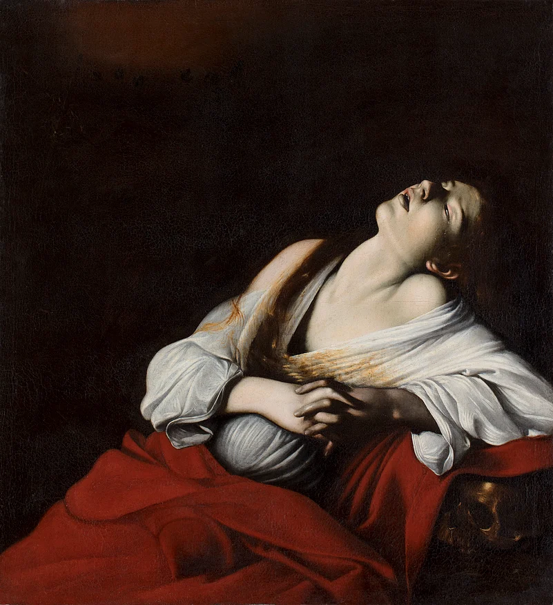 A woman, draped in a loose white robe, leans back, eyes almost closed