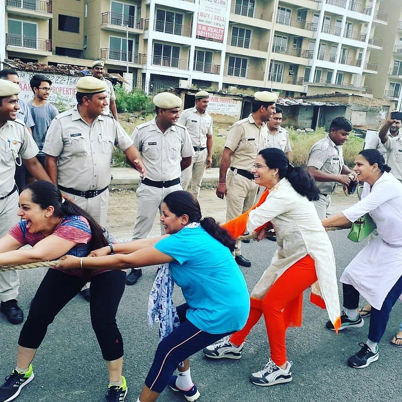 Women participating in Tug of War event