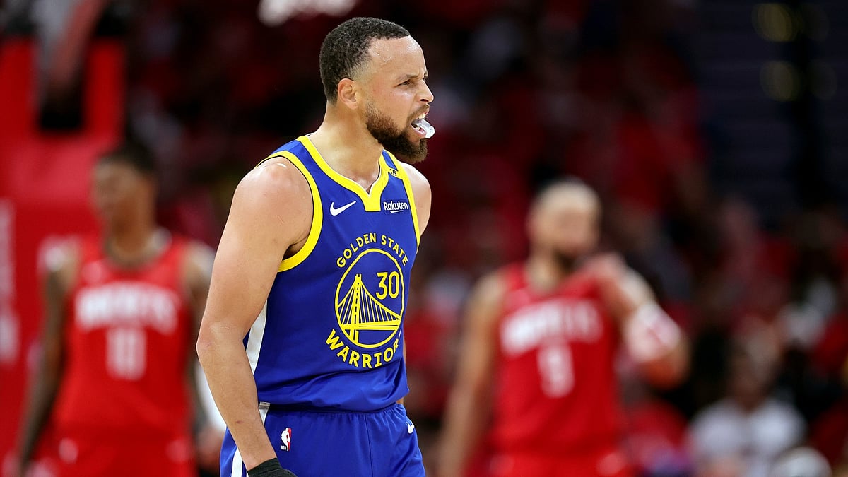 Stephen Curry celebrates during Game 1 of the Golden State Warriors' 2025 first-round playoff series vs. the Houston Rockets.