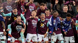 Martin Rickett/PA via AP : Burnley players celebrate their promotion to the English Premier League after the Championship soccer match against Sheffield United at Turf Moor, Burnley.