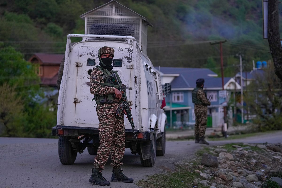 Indian security officers stand guard on a highway in south Kashmir after assailants indiscriminately opened fired at tourists in Pahalgam
 - AP: Dar Yasin