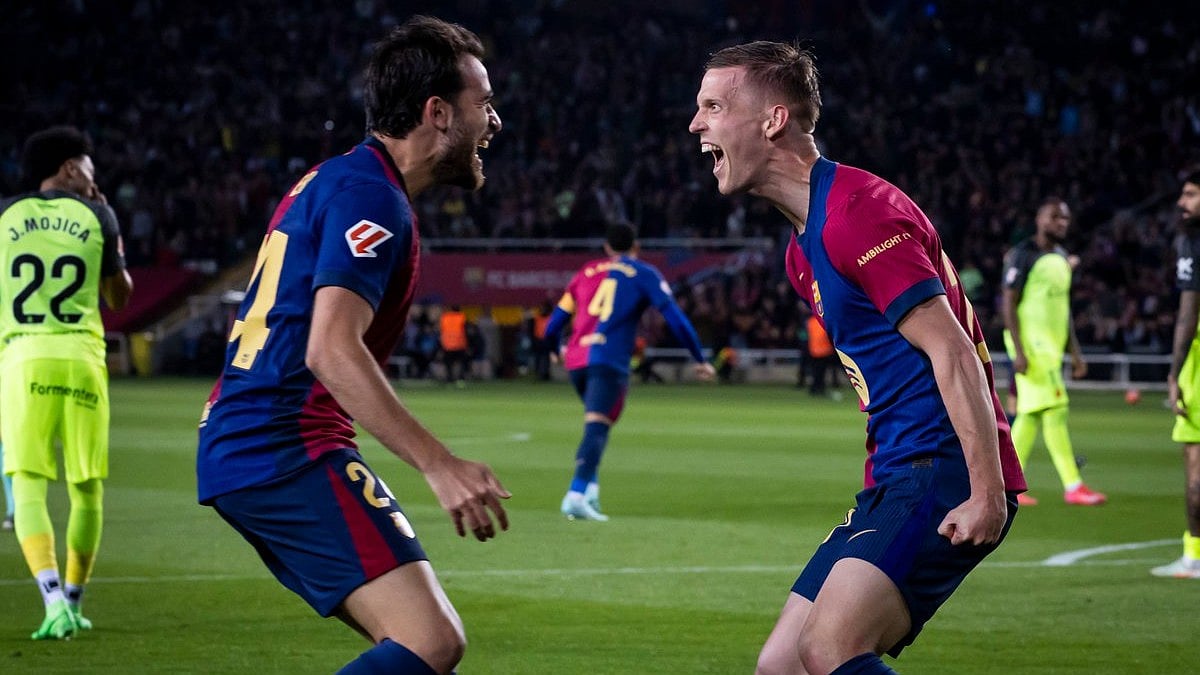 | Photo: X / FCBarcelona : FC Barcelona's Dani Olmo celebrates with Eric Garcia after scoring against RCD Mallorca in La Liga.