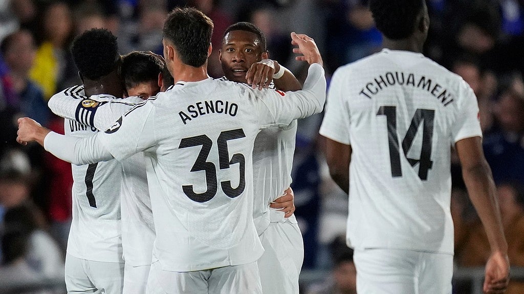 Photo: AP : Real Madrid's Arda Guler celebrates with teammates after scoring his side's opening goal during a Spanish La Liga match against Getafe. 