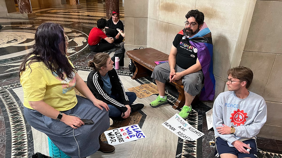 AP Photo/Margery Beck : Protesters of a Nebraska bill to bar transgender students from bathrooms, locker rooms, and sports teams that correspond with their gender identity gather outside the legislative chamber at the State Capitol on Tuesday.