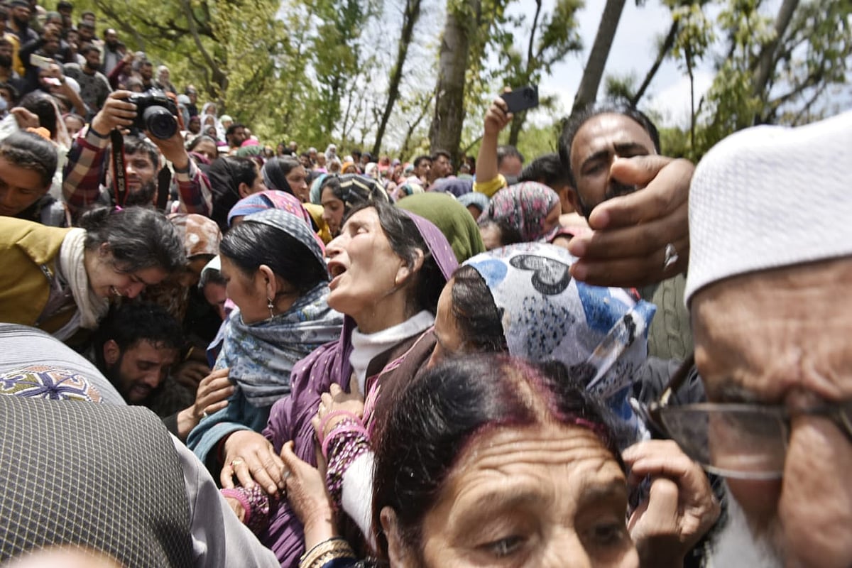 Adil's family, mother (centre) at his funeral - | Photo: Yasir Iqbal for Outlook India