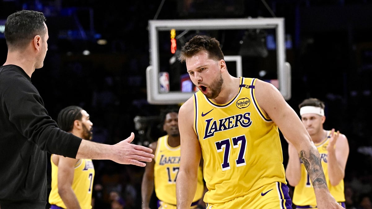Luca Doncic #77 of the Los Angeles Lakers reacts after hitting a three pointer against the Minnesota Timberwolves in the first half of a game 2 NBA first round playoff basketball game at Crypto.com Arena in Los Angeles on Tuesday, April 22, 2025.