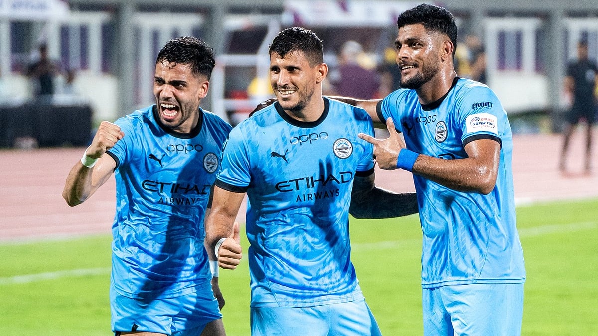 | Photo: X / MumbaiCityFC : Mumbai City's Nikos Karelis celebrates with teammates after scoring against Chennaiyin FC in Kalinga Super Cup 2025.