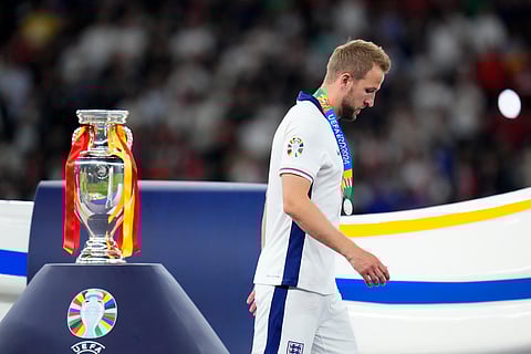 Harry Kane walks past the trophy after the UEFA Euro 2024 final match between Spain and England in Berlin, Germany on July 14, 2024. England lost the match 1-2.