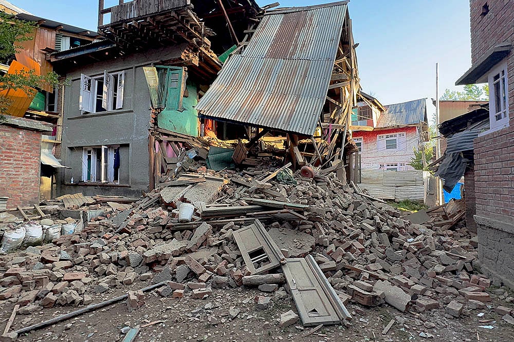 | Photo: PTI : Pahalgam terror attack suspect's house demolished