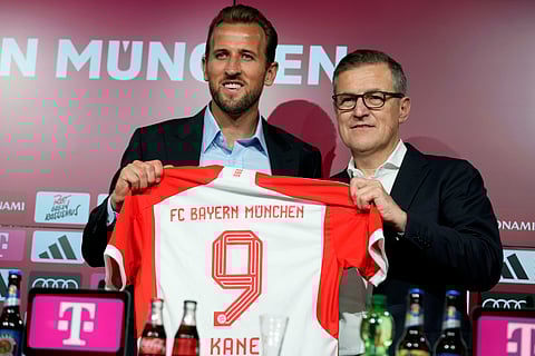 Harry Kane, left, and Bayern Munich CEO Jan Christian Dreesen after a news conference at the Allianz Arena stadium in Munich, Germany, Sunday, Aug. 13, 2023. Kane joined Bayern after leaving Tottenham Hotspur.