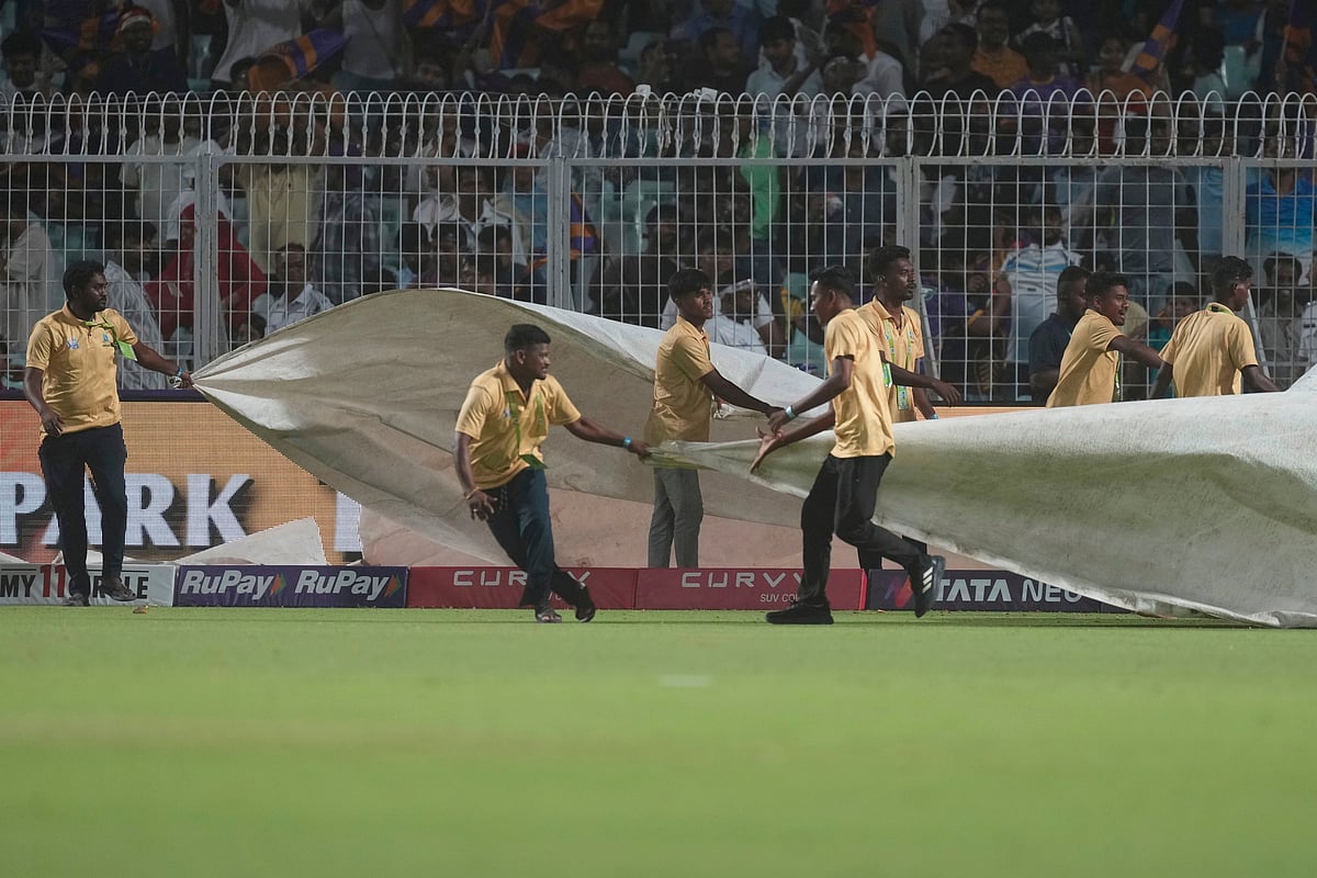 (AP Photo/Bikas Das)

 : Ground staff pulls rain covers during the Indian Premier League cricket match between Kolkata Knight Riders and Punjab Kings at Eden Gardens in Kolkata in Kolkata , India, Saturday, April 26, 2025. 
