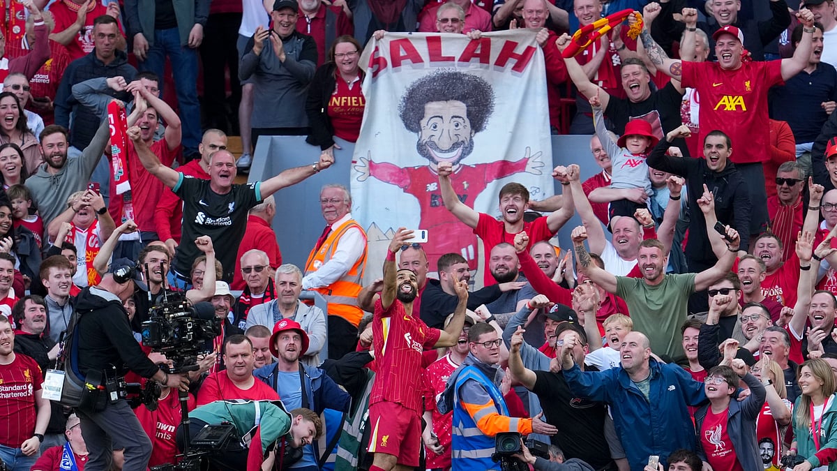 Liverpools Mohamed Salah takes a selfie with fans. AP