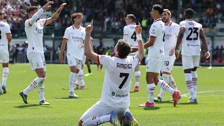 AC Milan's players celebrate Santiago Gimenez's goal - null