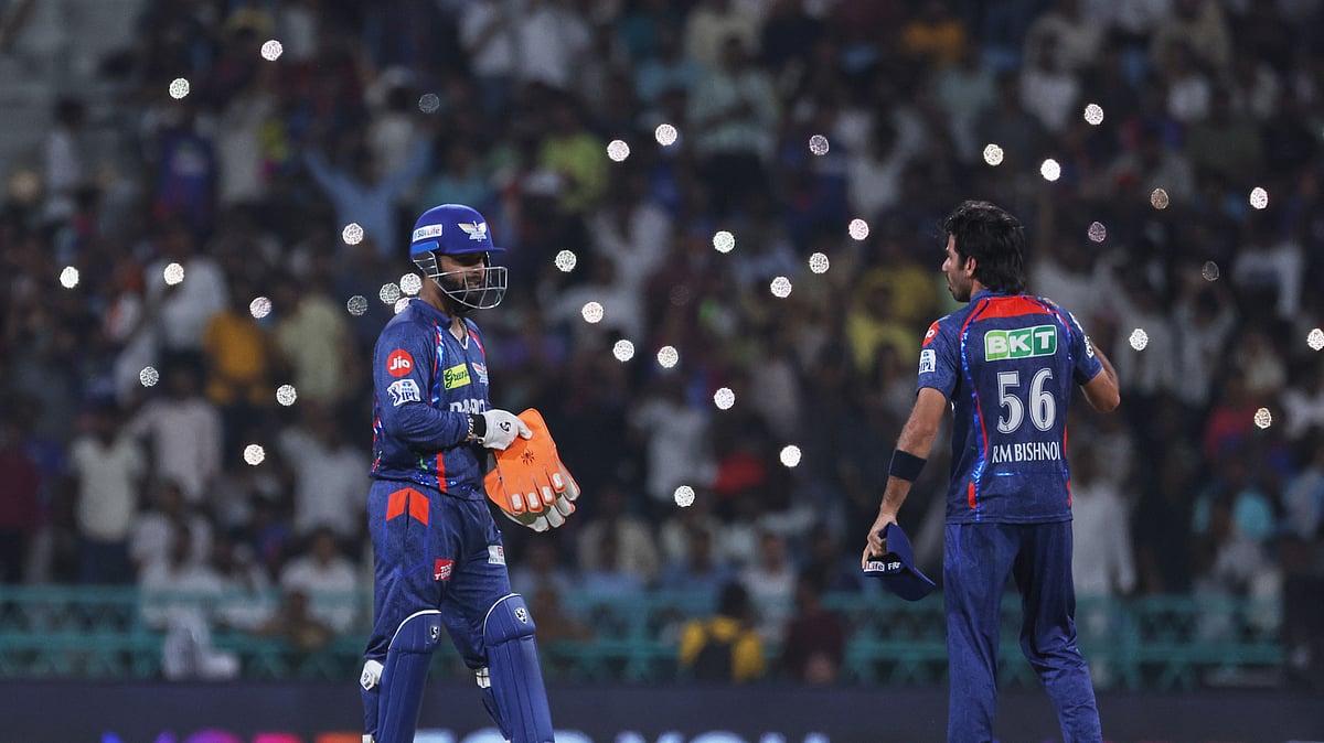 AP Photo : Lucknow Super Giants' captain Rishabh Pant, left, gestures with Ravi Bishnoi during the Indian Premier League cricket match in Lucknow.