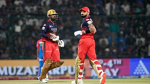AP Photo/Manish Swarup : Royal Challengers Bengaluru's Virat Kohli, right, and batting partner Krunal Pandya run between the wickets to score during the Indian Premier League cricket match in New Delhi.