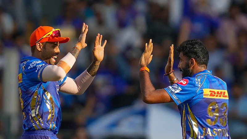 Mumbai Indians Jasprit Bumrah, right, and Mumbai Indians. AP