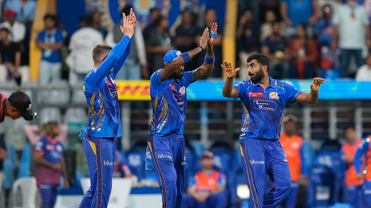 Mumbai Indians Jasprit Bumrah, right, celebrates the dismissal. AP