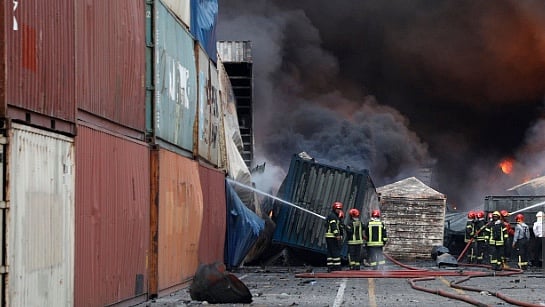 Getty images : Firefighters at the scene of an explosion that took place at the Shahid Rajaee port dock