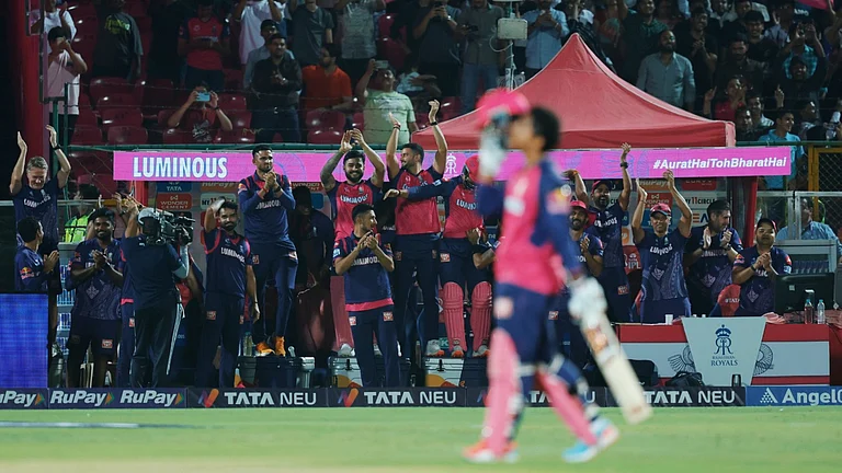 Vaibhav Suryavanshi celebrating his maiden IPL ton as teammates and coaches applaud from the dug-out in Jaipur on Monday. - Photo: X | Rajasthan Royals
