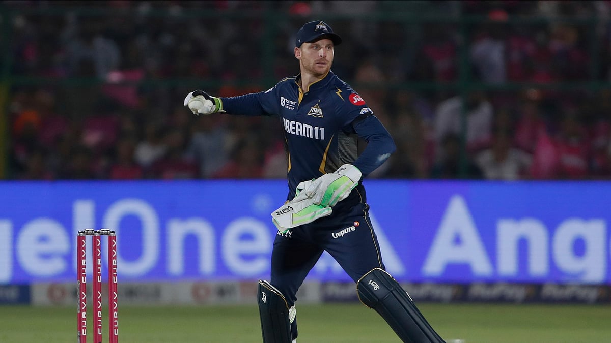 AP Photo/Surjeet Yadav : Gujarat Titans' wicketkeeper Jos Butler fields the ball during the Indian Premier League cricket match between in Jaipur.