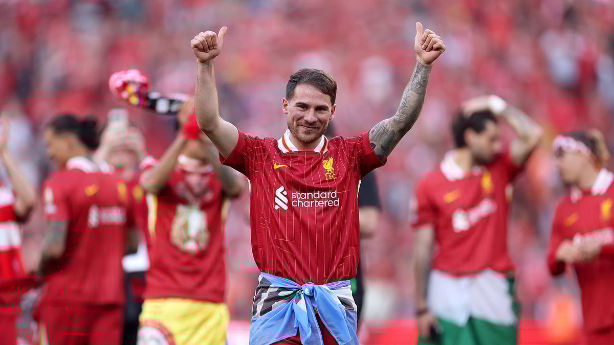 Alexis Mac Allister celebrates Liverpool's Premier League title win. - null