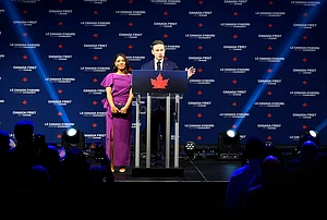 | Photo: Adrian Wyld for The Canadian Press/ AP : Conservative Leader Pierre Poilievre speaks to supporters with his wife Anaida Poilievre at his campaign headquarters on election night, in Ottawa