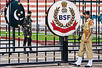 | Photo: PTI : Too Close for Comfort: Border Security Force soldiers and Pakistani Rangers stand guard at Attari-Wagah border