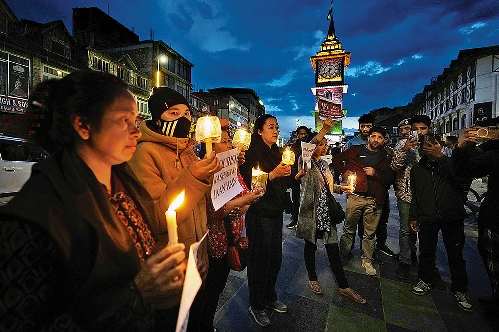 In Solidarity: People gather for a candle march in Srinagar  - | Photo: AP