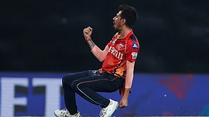 (AP Photo/Surjeet Yadav) : Punjab Kings' Yuzvendra Chahal celebrates the dismissal of Kolkata Knight Riders' Ramandeep Singh during the Indian Premier League cricket match..