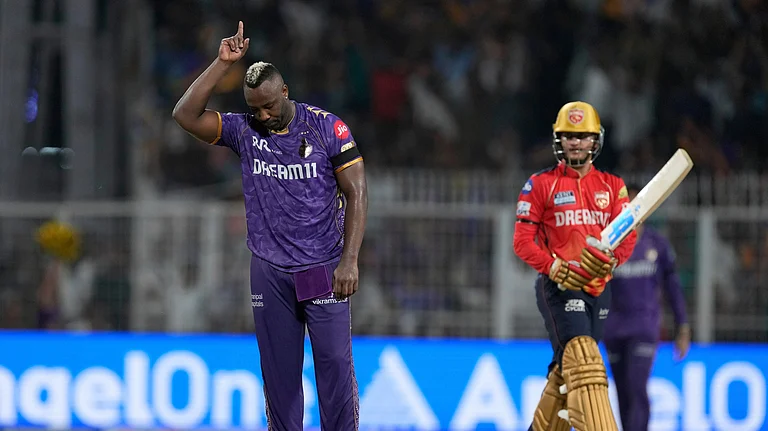 Kolkata Knight Riders' Andre Russell celebrates the wicket of Punjab Kings' Priyansh Arya at Eden Gardens in Kolkata in Kolkata. - AP Photo/Bikas Das