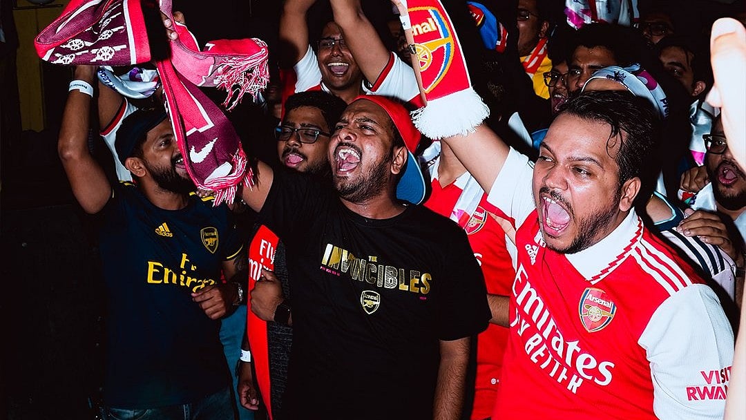 Indian fans of Arsenal FC cheer during a Premier League match. - | Photo: X / PLforIndia