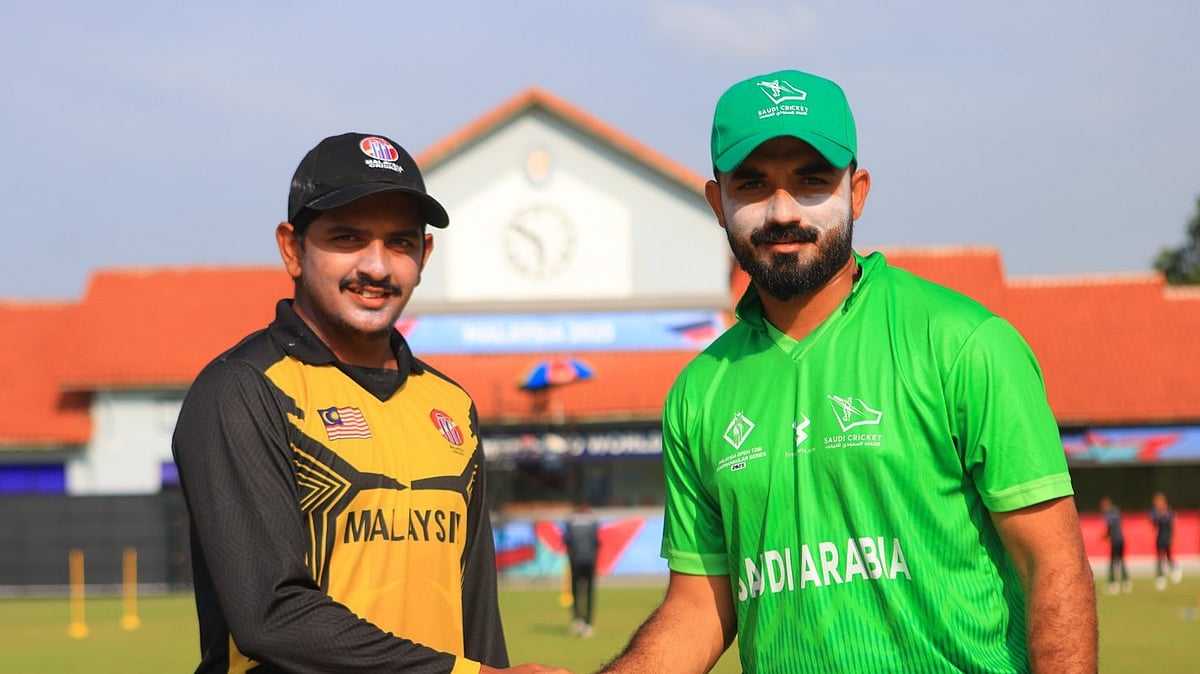 Photo: X | Malaysia Cricket : Malaysia cricket team captain with the Saudi Arabia skipper after the toss for a cricket match in Kuala Lumpur.