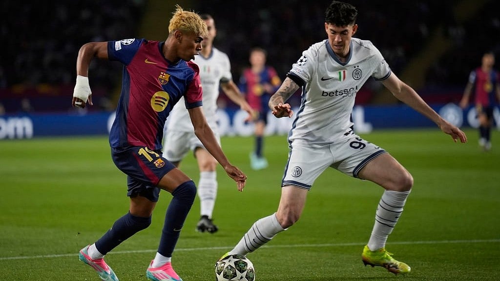 AP : Inter Milan's Alessandro Bastoni guards Barcelona's Lamine Yamal during the Champions League semifinal first leg soccer match between Barcelona and Inter Milan in Barcelona.