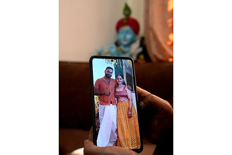 Lt Vinay Narwal stands with his arm around his sister Shrishti