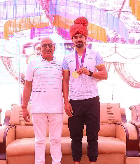 Abhishek Nain with his coach Shamsher Singh Dahiya.
