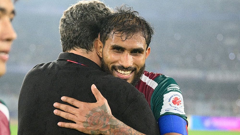 Mohun Bagan Super Giant skipper Subhasish Bose embraces head coach Jose Molina after the win