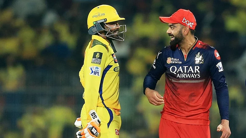 Royal Challengers Bengalurus Virat Kohli, right, and Chennai Super Kings Ravindra Jadeja chat.
