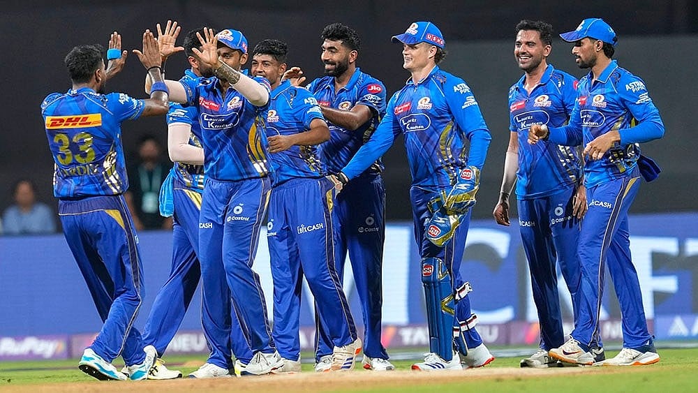 | Photo: AP/Rajanish Kakade : IPL 2025: Mumbai Indians celebrating a win against Chennai Super Kings.