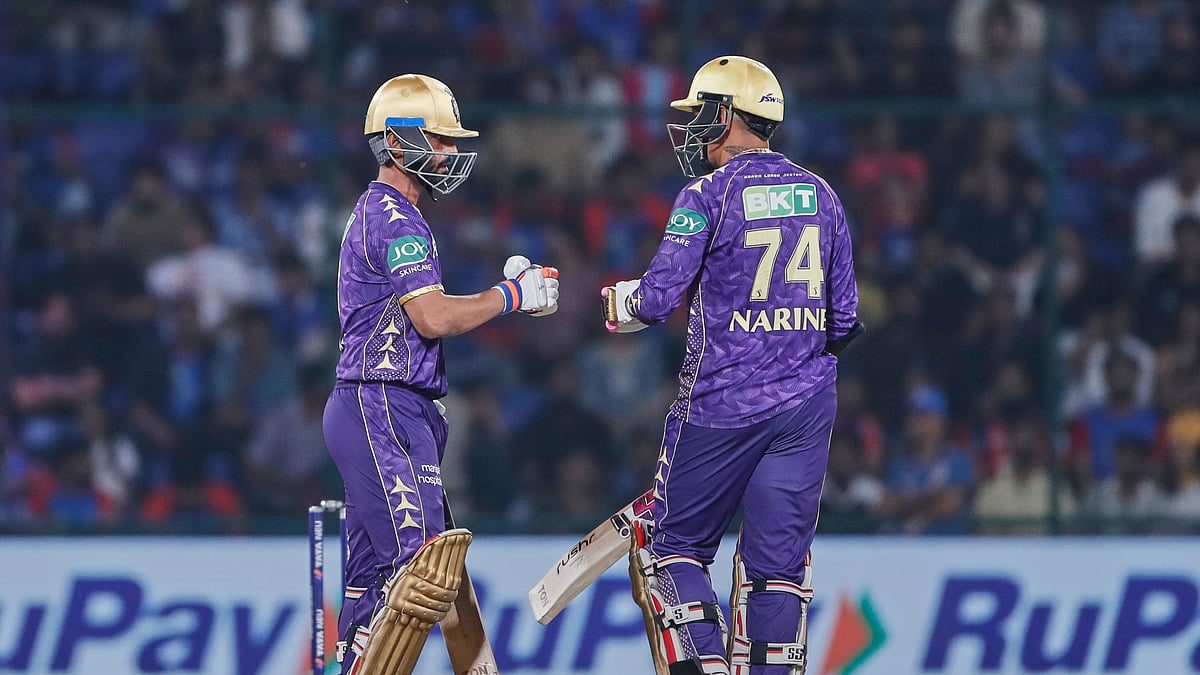 Kolkata Knight Riders captain Ajinkya Rahane, left, fist bumps. AP