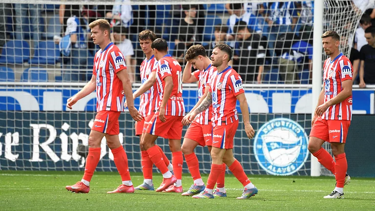 Atletico Madrid's players trudge off after the goalless draw - null