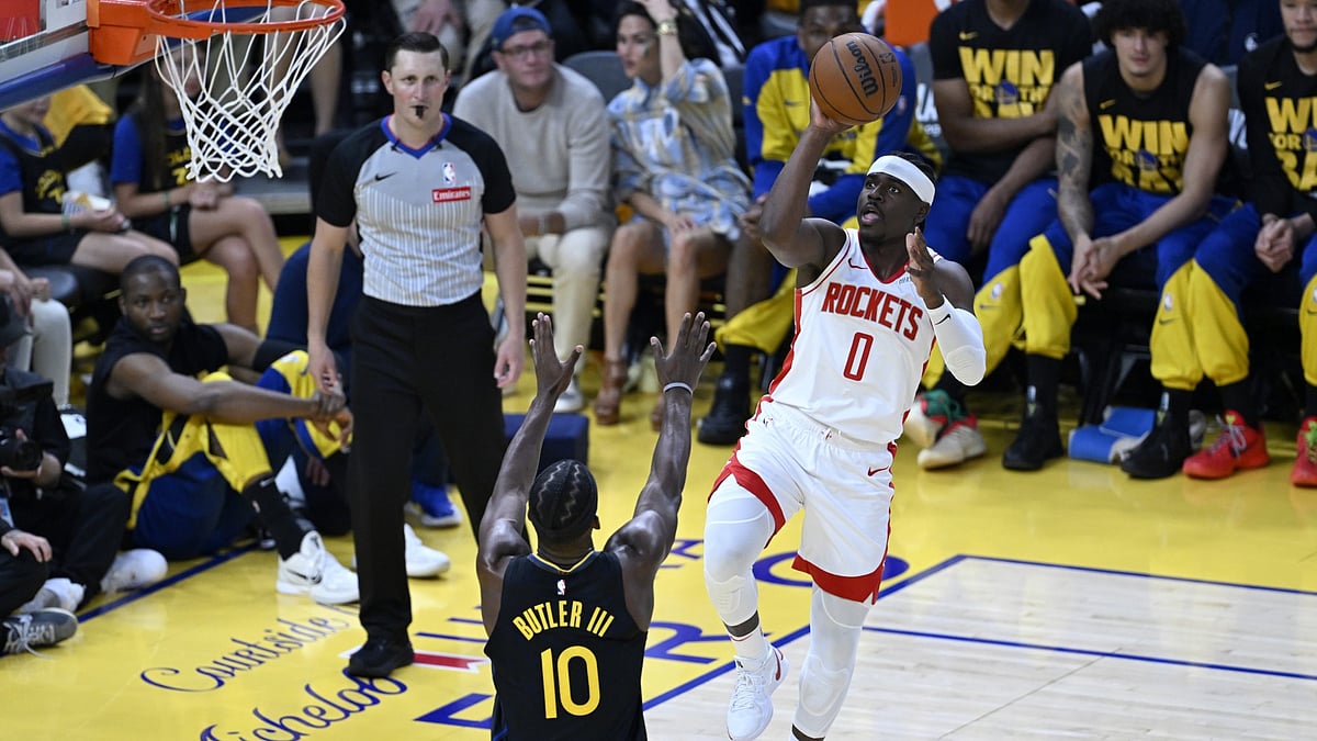 Aaron Holiday (0) of Houston Rockets in action against Jimmy Butler (10) of Golden State Warriors during NBA Playoffs game 6 between Houston Rockets and Golden State Warriors at Chase Center on May 2, 2025 in San Francisco, California, United States.