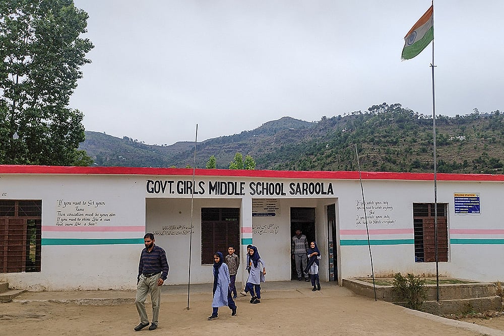 | Photo: PTI : Students take shelter in bunkers during firing at LoC